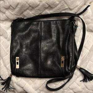 MMS Design Studio Black Crossbody Bag with Gold Accents.